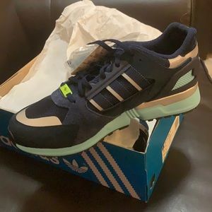 Adidas ZX 10,000 JC. Size 10. Navy blue with 2 extra shoestrings colors.